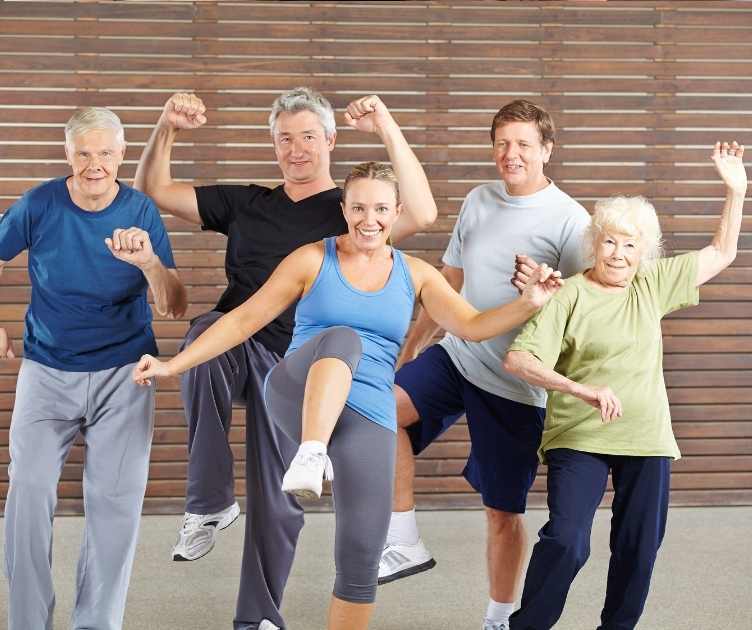 a group of people enjoying an indoor fitness class